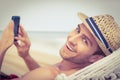 Handsome man texting on the hammock Royalty Free Stock Photo