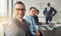 Handsome man with three co-workers in meeting Royalty Free Stock Photo