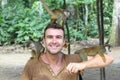 Handsome man with titi monkey`s group Royalty Free Stock Photo