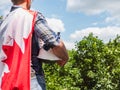 Handsome man with tools, holding a Canadian Flag Royalty Free Stock Photo