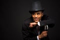 Handsome man in top hat posing with cane Royalty Free Stock Photo