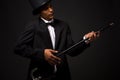 Handsome man in top hat posing with cane Royalty Free Stock Photo