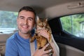 Handsome man traveling with his cat Royalty Free Stock Photo