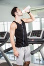 handsome man on treadmill drinking water Royalty Free Stock Photo