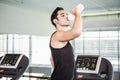 handsome man on treadmill drinking water Royalty Free Stock Photo