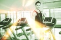 Handsome man on treadmill drinking water Royalty Free Stock Photo