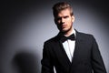 Handsome man in tuxedo and bow tie in a dramatic pose Royalty Free Stock Photo