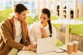 Handsome man typing on laptop keyboard and worried girl looking at screen Royalty Free Stock Photo