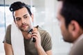 Handsome man using electric razor Royalty Free Stock Photo