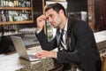 Handsome man using laptop computer Royalty Free Stock Photo