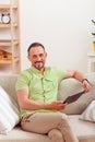 Handsome man using tablet PC at home Royalty Free Stock Photo