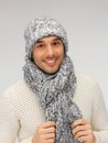 Handsome man in warm sweater, hat and scarf