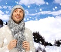 Handsome man in warm sweater, hat and scarf