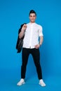 Handsome man wear black leather jacket. full length photo of a young casual man Royalty Free Stock Photo