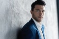 Handsome man wear blue suit isolated on grey background. Royalty Free Stock Photo
