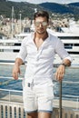 Handsome man wearing aviator sunglasses and posing in port Royalty Free Stock Photo