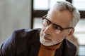 Handsome man wearing glasses working as interior designer