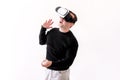 Handsome man wearing and playing virtual reality on isolated white background. Boy action in virtual reality helmet. VR glasses. Royalty Free Stock Photo