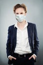 Handsome man wearing suit and surgical face mask, Covid-19 coronavirus concept Royalty Free Stock Photo