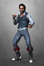 Handsome man in pirate style costume standing in a fighting pose Royalty Free Stock Photo