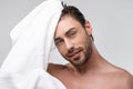 handsome man with wet hair and towel