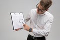 Young man in glasses with insurance and magnifier in hand isolated on white background