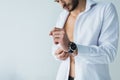 handsome man in white shirt wearing wristwatch, Royalty Free Stock Photo
