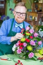 Handsome Man Working in Flower Shop Royalty Free Stock Photo