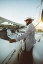 A black man is driving a luxury boat Royalty Free Stock Photo