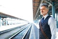 Mature businessman on a train station. Royalty Free Stock Photo