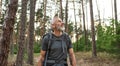 Handsome mature caucasian man walking alone in forest Royalty Free Stock Photo