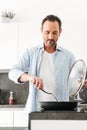 Handsome mature man cooking Royalty Free Stock Photo