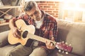 Handsome mature man with guitar Royalty Free Stock Photo