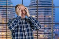 Handsome mature man holds his head with both hands. Royalty Free Stock Photo