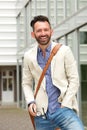 Handsome mature man standing outdoors and smiling Royalty Free Stock Photo