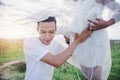 Handsome man is listening to his beautiful pregnant wife`s tummy with cup Royalty Free Stock Photo