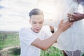 Handsome man is listening to his beautiful pregnant wife`s tummy with cup Royalty Free Stock Photo