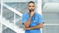 Handsome mexican male nurse or doctor with beard and stethoscope