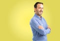 Handsome senior man isolated over yellow background Royalty Free Stock Photo