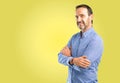 Handsome senior man isolated over yellow background Royalty Free Stock Photo