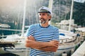 Middle age man in marina with a happy face standing and smiling with a confident Royalty Free Stock Photo