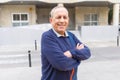 Handsome middle age senior man smiling cheerful, happy and positive with crossed arms at the city town Royalty Free Stock Photo