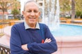 Handsome middle age senior man smiling cheerful, happy and positive with crossed arms at the city town Royalty Free Stock Photo