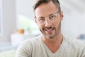 Handsome middle-aged man wearing white eyeglasses Royalty Free Stock Photo
