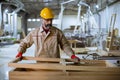 Handsome middle aged worker working in the furniture factory Royalty Free Stock Photo