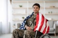 Handsome military guy in wheelchair with flag of the US Royalty Free Stock Photo