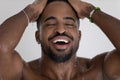 Handsome mixed race black man relaxing and taking shower Royalty Free Stock Photo