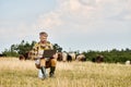 handsome modern farmer with beard sitting