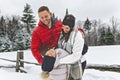 Handsome mother, father and his daughter are having fun outdoor in winter Royalty Free Stock Photo