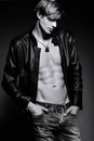 Handsome muscled fit male model man in leather jacket Royalty Free Stock Photo